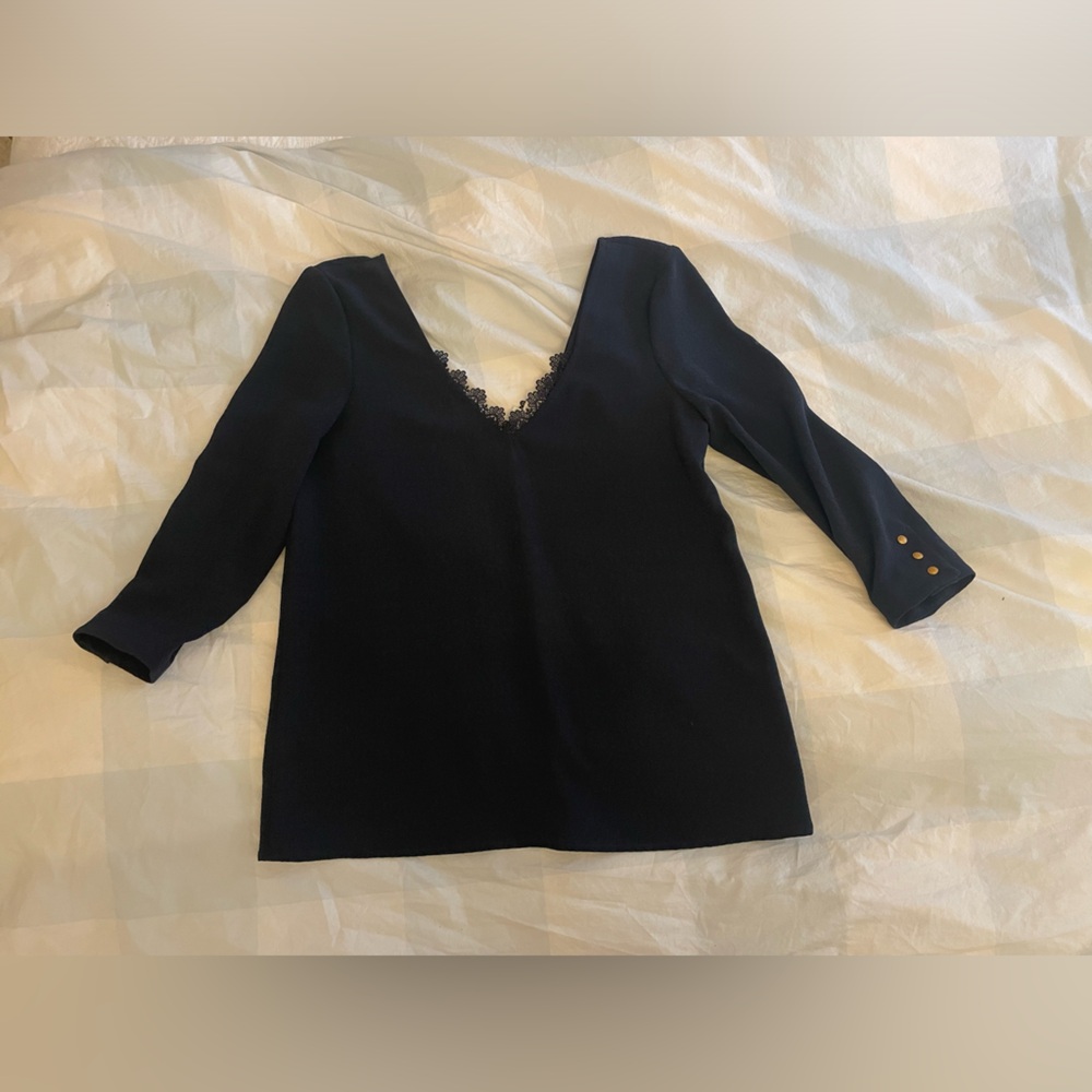 Sezane double V-neck navy blouse with lace detail ￼